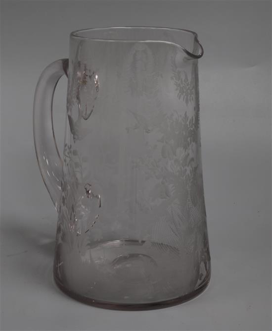 A Stourbridge glass jug engraved with birds, leafy swags and flowers height 20cm